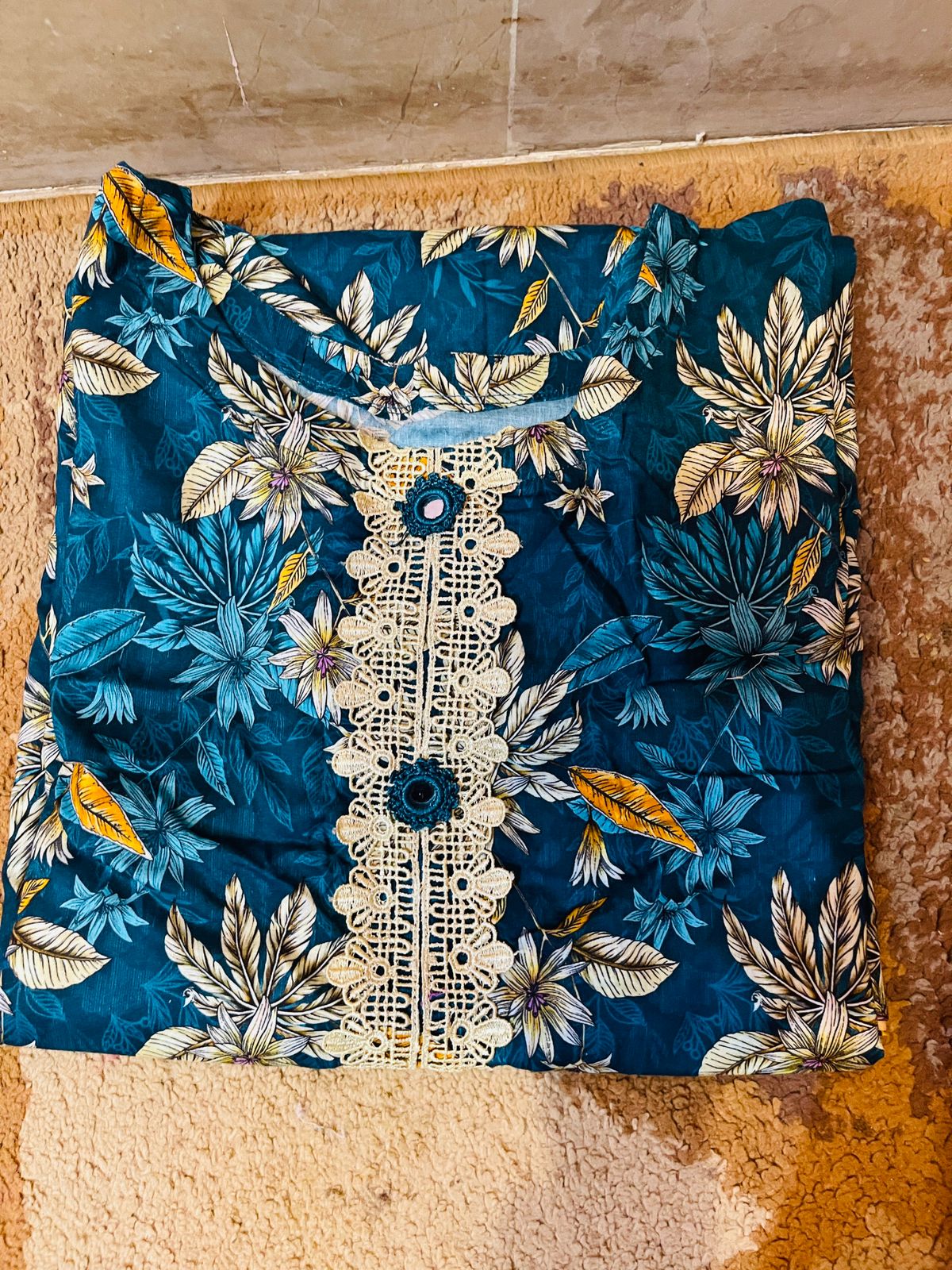 floral-patterned kurti (tunic) in shades of teal